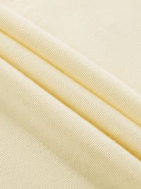 Close-up of beige fabric with a subtle texture