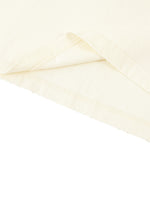Slightly folded bottom of the light apricot Standard Bearer Vintage Wash T-Shirt to display the quality of the t-shirt