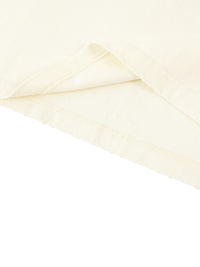 Slightly folded bottom of the light apricot Standard Bearer Vintage Wash T-Shirt to display the quality of the t-shirt