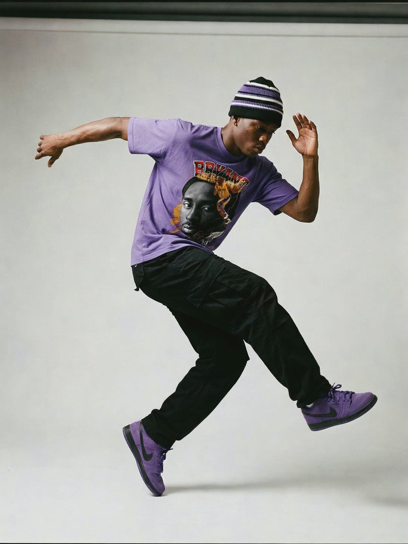 Kobe Tshirt Iconic Style - Graphic Comfort | 100% Cotton purple tee featuring bold Kobe BigFace design, worn with black pants and matching sneakers.