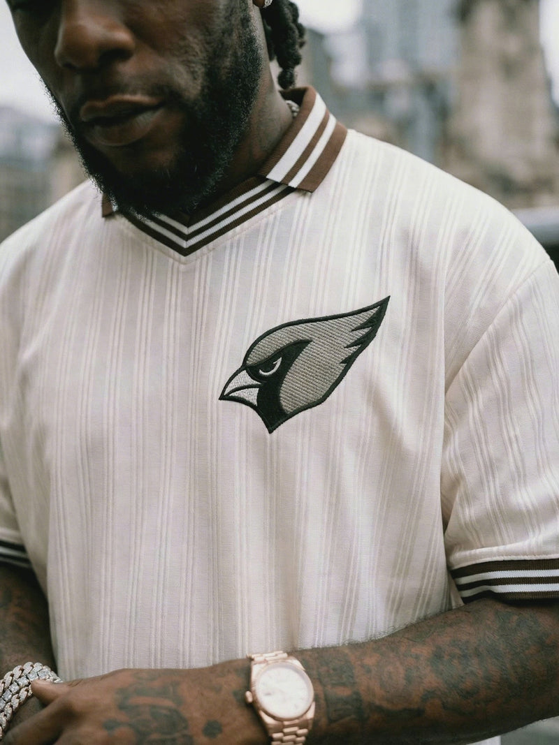 model wearing contrast striped polo in the city