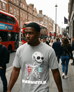 Wake UP Oversize T-Shirt in snow washed grey worn on a city street, featuring a skeleton graphic with coffee cup. Ideal for casual summer wear.