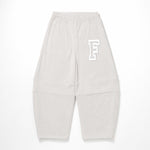 Light gray sweatpants with an elastic waistband, cuffed ankles, and a white outlined letter 'F' logo on the upper left leg, shown flat on a white background.