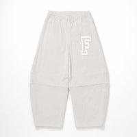 Light gray sweatpants with an elastic waistband, cuffed ankles, and a white outlined letter 'F' logo on the upper left leg, shown flat on a white background.